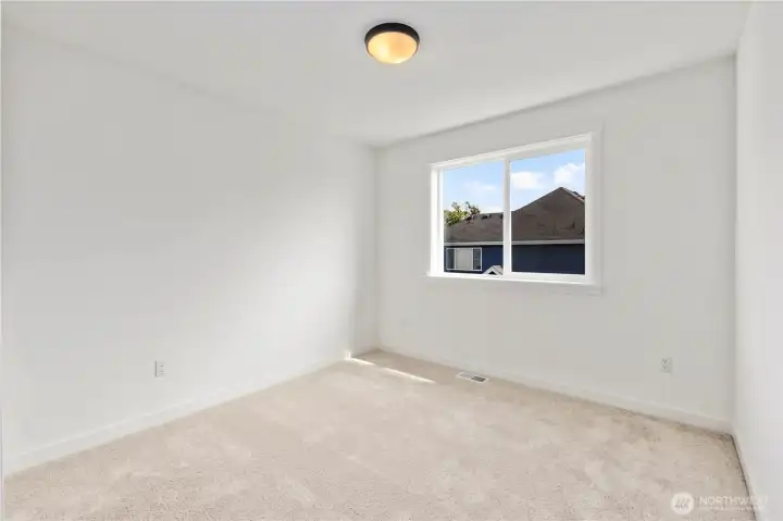 Upper Bedroom: Comfortable upstairs bedroom with bright natural light and plush carpet. Perfect for use as a guest room, office, or play space.  These photos are of the actual, staged home being sold at Foxmoore. However, all photos, renderings, site maps, and floorplans are for visualization purposes only. Plans, colors, building orientation, finishes, home outlook, and other details can and WILL vary.