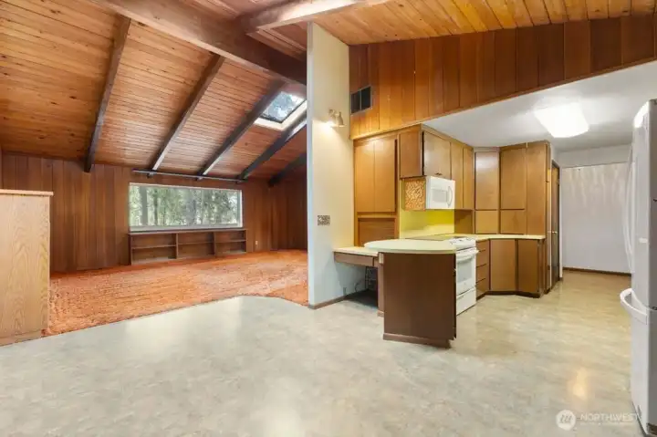 Additional view of the great room, kitchen and dining room.