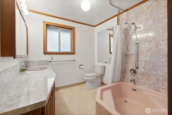 Spacious main level bathroom complete with soaking tub.