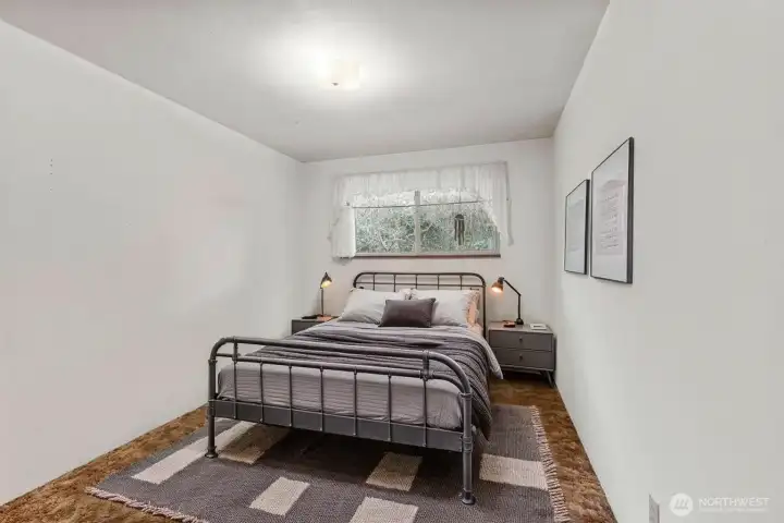 View of the staged 2nd bedroom located on the main level.