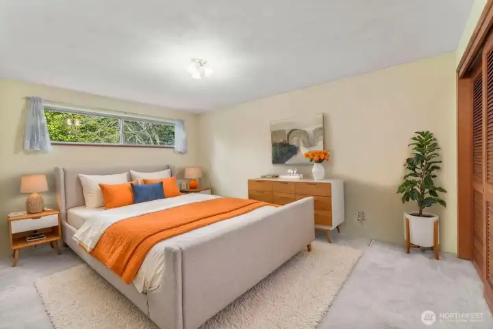 View of the staged 3rd bedroom located on the main level.