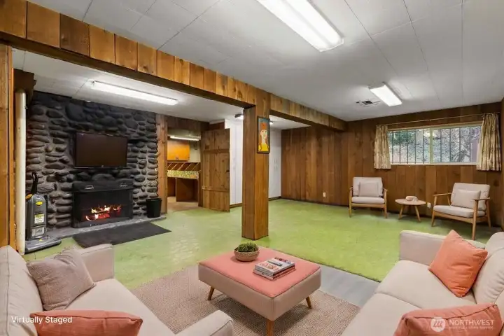 Huge bonus/rec room located on the main level features a wood burning fireplace, lower level features a separate entry and a chairlift to the main level.
