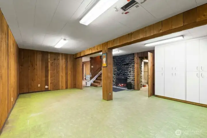 Additional view of the rec. room showing the extra storage space this home has to offer.