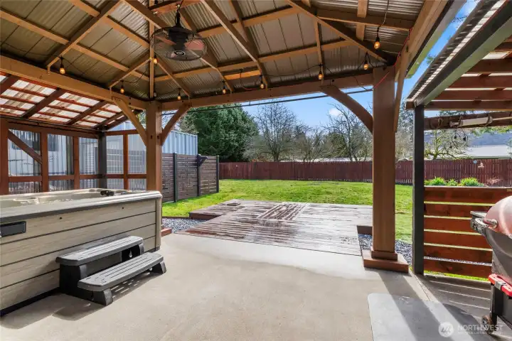 Gazebo covered patio with fan for outdoor enjoyment year round.
