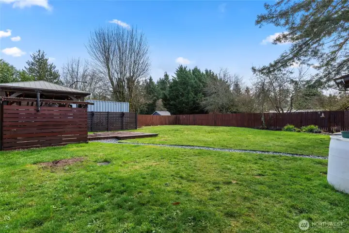 Back: Cedar privacy fencing.