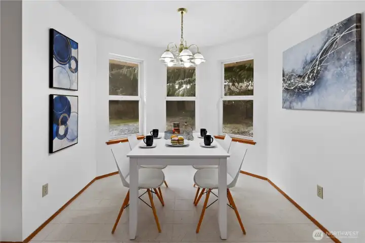 A beautiful, light, airy breakfast nook overlooking the back yard