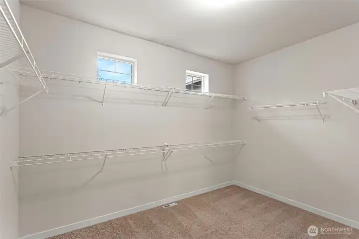 Huge primary bedroom walk in closet