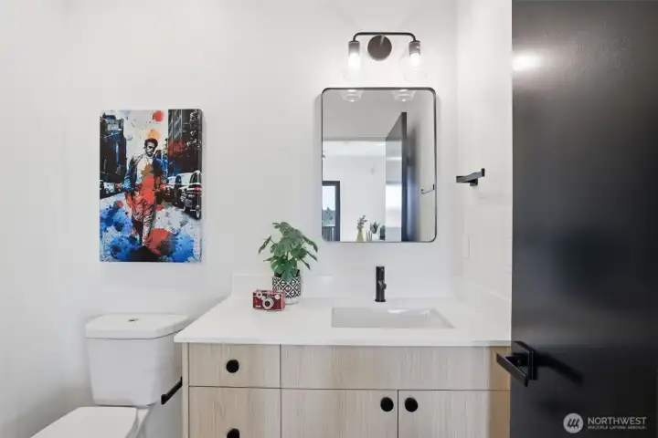 Chic powder room with quartz vanity, modern fixtures, and clean contemporary finishes.