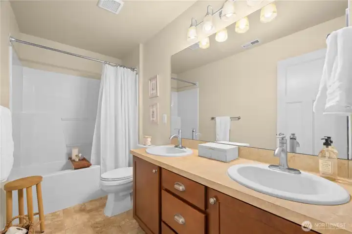 Second full bathroom upstairs services the other rooms.