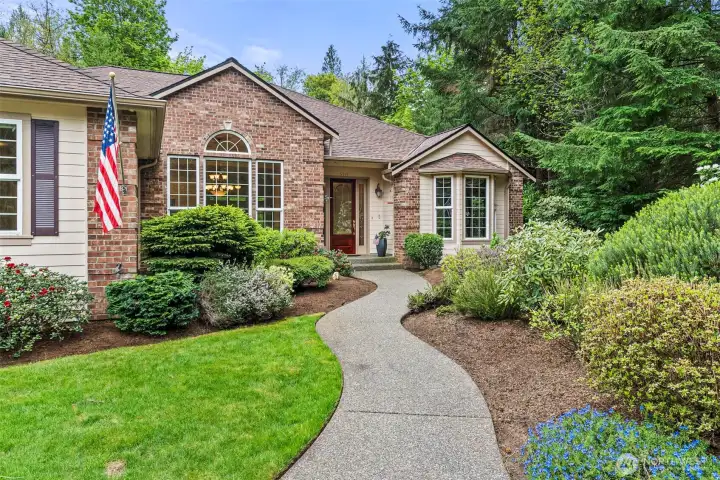 Pretty pathway meanders through the mature landscape to your front porch.