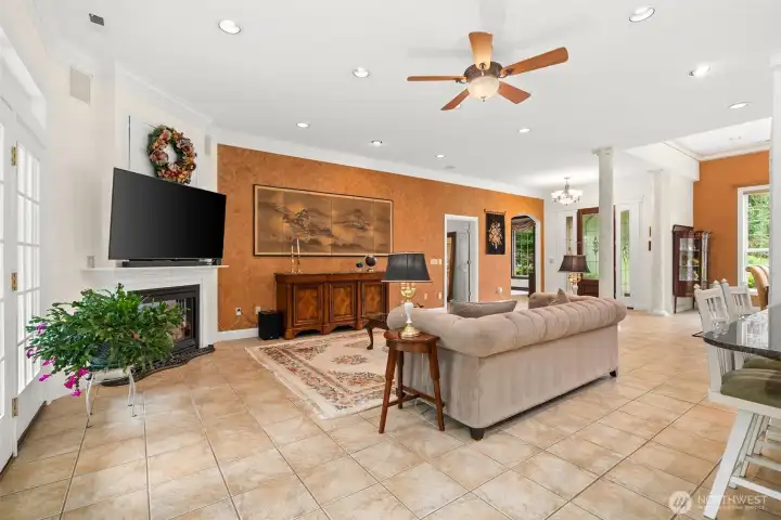 Another look toward the great room from the kitchen/casual dining area. Doorway to left of the office leads to primary suite in this split bedroom layout.