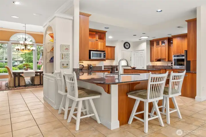 So much countertop workspace and look at all the seating - with casual dining to the right of the photo, this counter seating, the formal dining space in the distance AND covered patio, you'll have endless options on those days when 'everyone' is over!