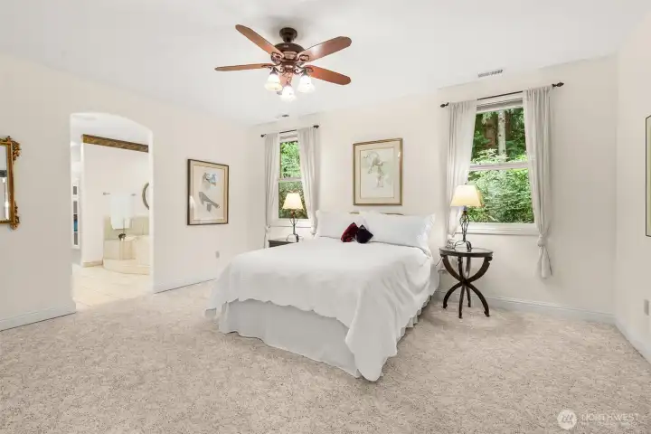 Peaceful and private primary wing features a very spacious bedroom, large 5-peice bath and amply sized walk-in closet.