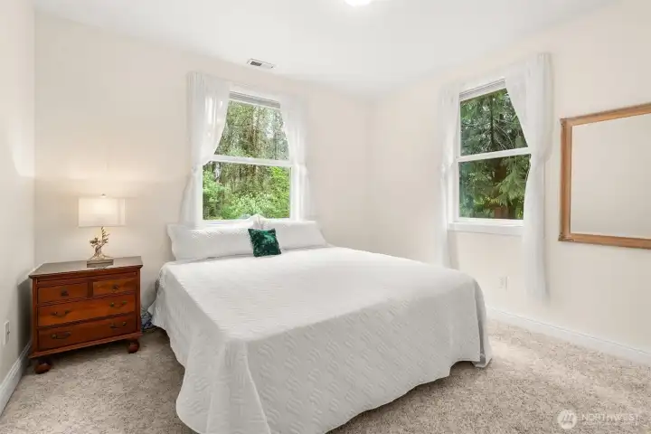 Desirable split floor plan includes two additional bedrooms at the opposite end of the home from the primary. Windows on two walls bring extra light into this room, and you'll find 2 closets!