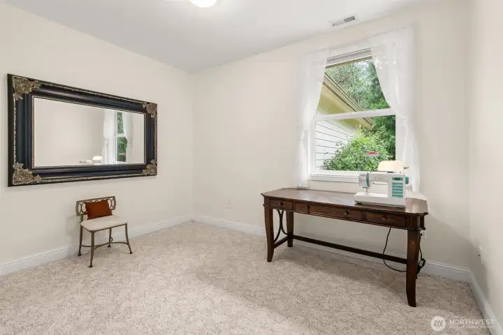 One of two additional bedrooms - this one is currently used as a sunny sewing spot.