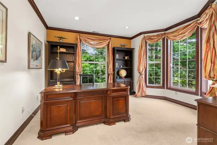 Office with built in shelving and big bay window - an enjoyable spot for taking care of business!