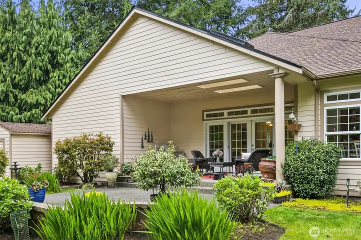 Covered patio with skylights is an inviting spot to read or visit; large uncovered patio expands your outdoor entertaining options.