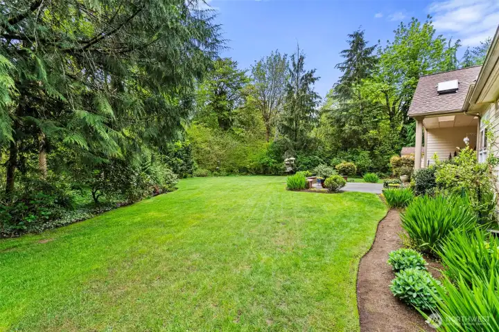 Beauty every direction you look in and around this large rear yard.