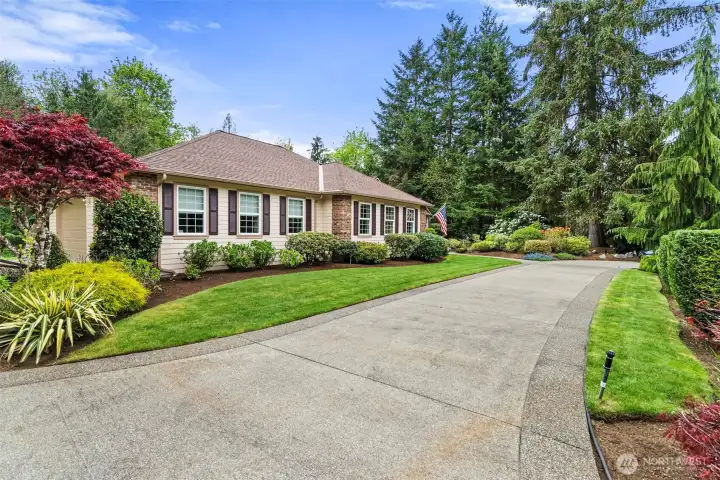 Gorgeous grounds surrounding the home are kept lush and green with the help of the sprinkler system.