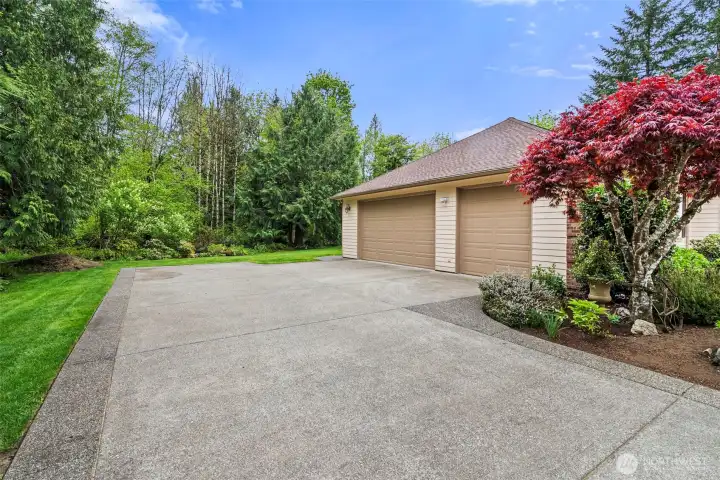 Oversized (864 sf) 3-car garage has sleek epoxy-coated floors and so much storage space.