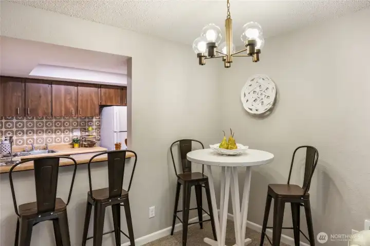 Original chandelier is stylish and classic for the overall natural dining space.