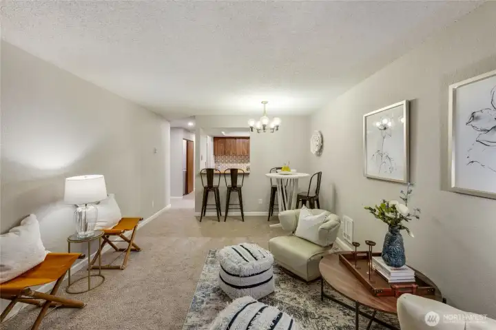 New carpet, fresh paint, and new baseboard trim lighten up this condo and give it a more modern feel.