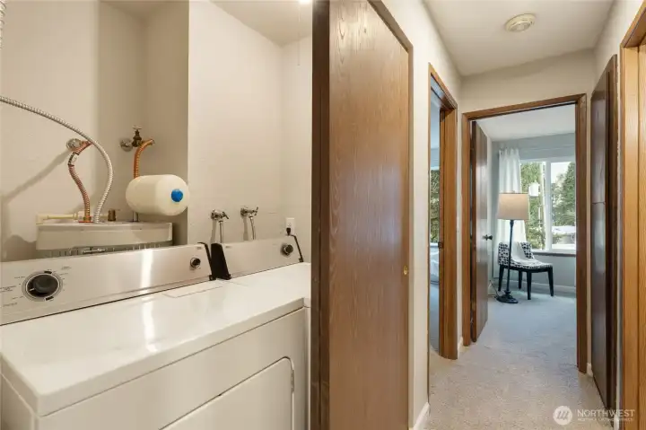 Utility zone is tucked in a small room/nook with sliding doors. Washer and dryer are included!