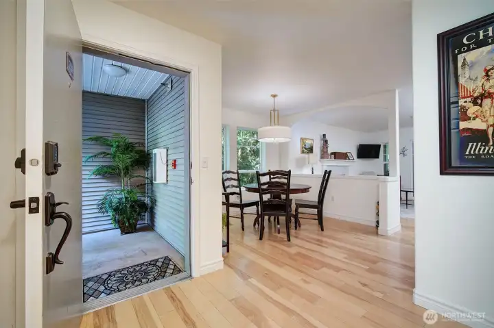 The foyer opens to the dining & living areas.