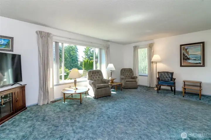 Livingroom with hardwood flooring under that carpet.