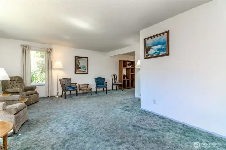 Livingroom with hardwood flooring under that carpet.