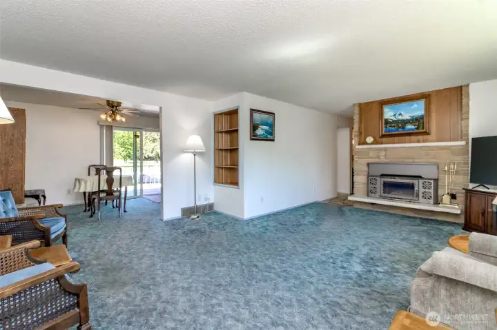 Livingroom with hardwood flooring under that carpet.