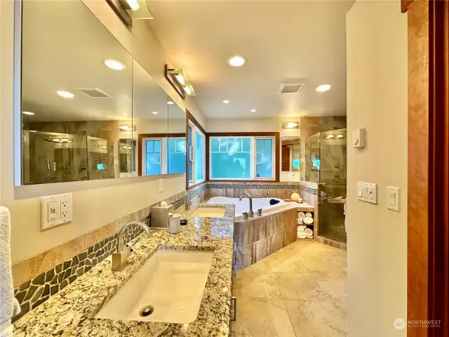 • Continuous tile design from shower around tub and over sinks