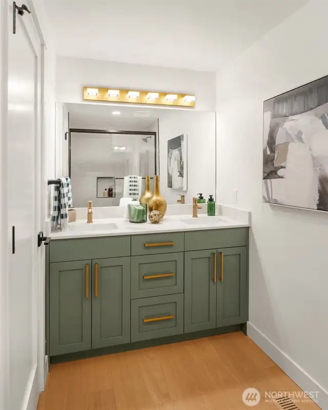 Full bath serves two additional bedrooms on upper level