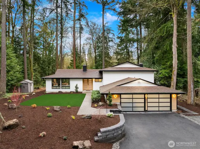 Fully remodeled and landscaped with custom metal railing, fresh hardscape