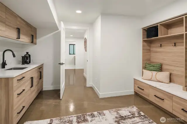 Mud room with laundry room off garage on lower level, perfect for dropping everything at the end of a long day