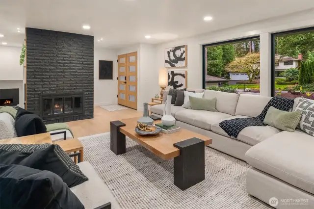 Light and bright open concept living with engineered oak flooring and new oversized Milgard windows