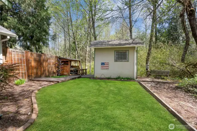 Back yard shed from side of house.