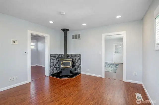 Inviting and cozy living room with wood-buringing fireplace