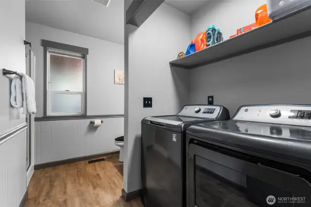 Laundry/bath combo has stand up shower as well.