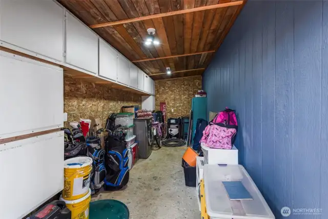 Huge storage shed behind the house under the deck