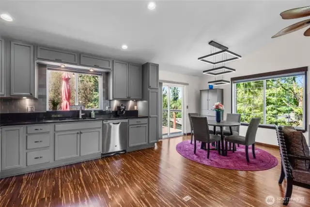Eating area off kitchen with slider to deck.