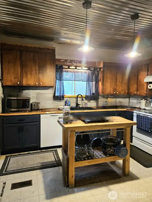 Kitchen - notice the upgraded pendant lighting and ceiling