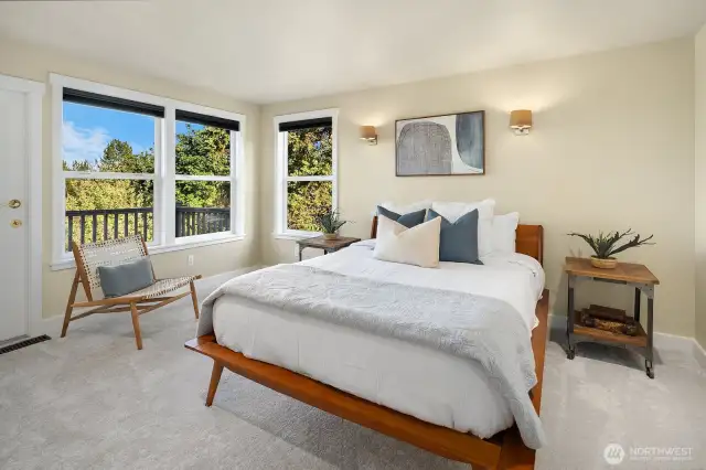 Upstairs primary bedroom with it's own deck, walk-in closet and spa bath with steam shower and soaker tub.