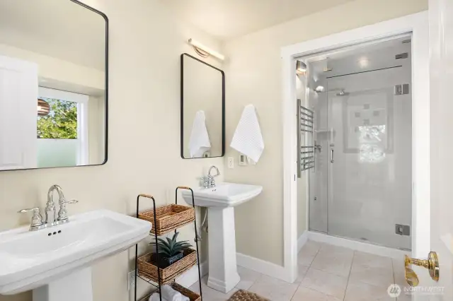 Spa like bathroom with steam shower and soaker tub.