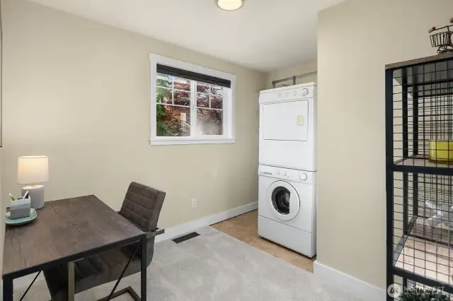 Bedroom converted to office /laundry. The house has two laundry areas.