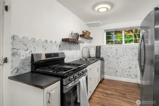 2nd kitchen. New tile backsplash and newer stainless steel appliances.