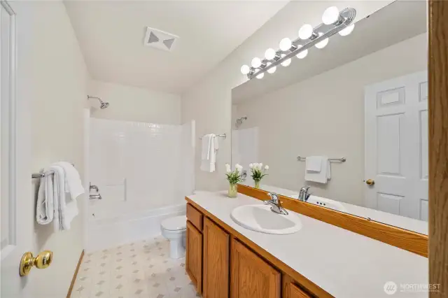 Shared full bathroom on the upper level.