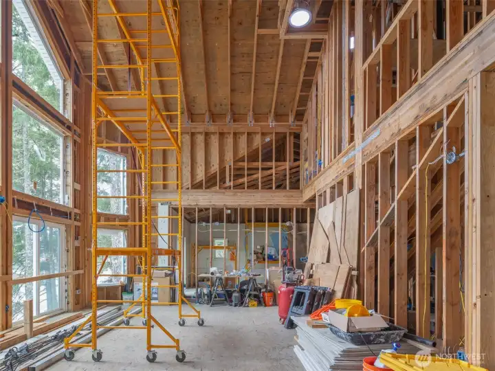 Great room with master bedroom in the background.