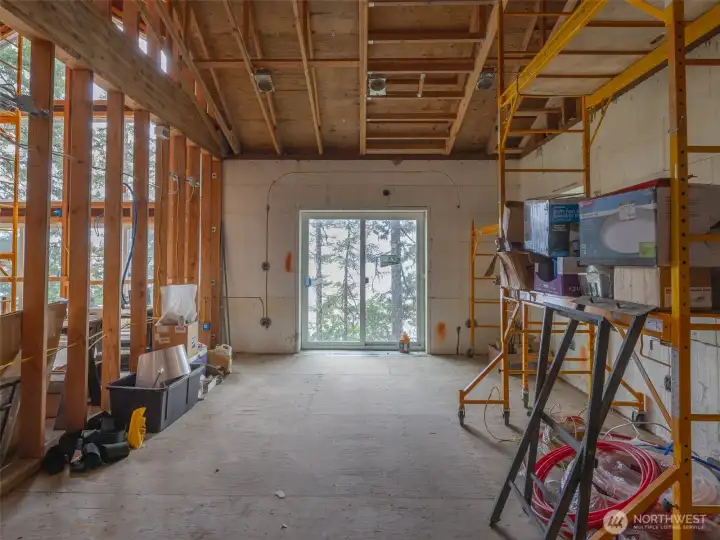 Master Bedroom with great room to the left. The home is planned with it's own outside deck overlooking the Hood Canal.