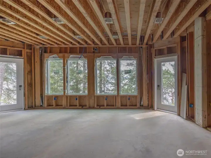 Basement great room. 9' ceilings with planned minibar to the right. Excessive plugins for all your electrical needs... aquariums, electronics etc.